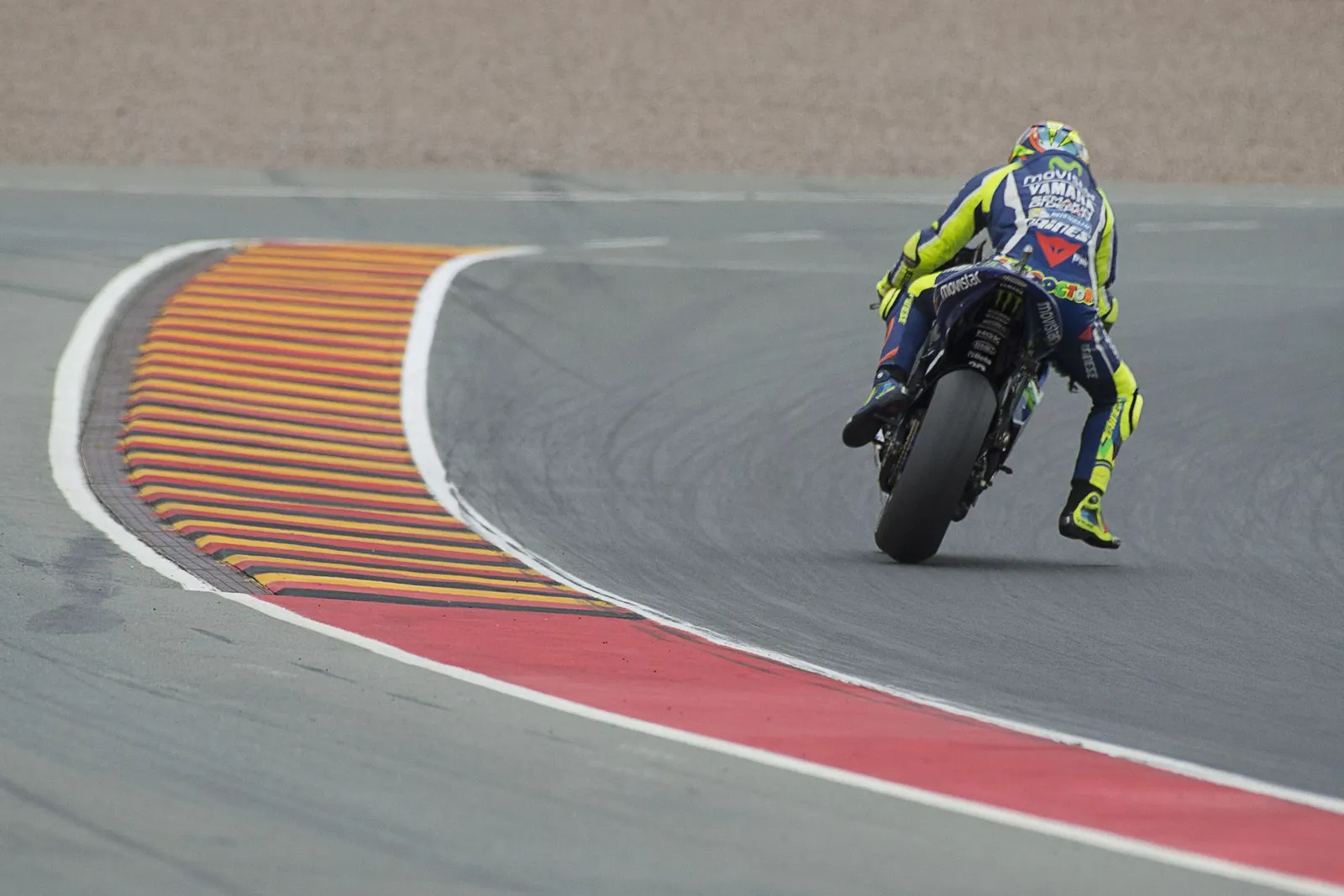 Why do MotoGP riders dangle a leg?