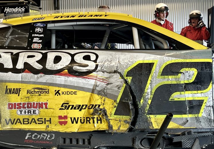 Damage to the right side of Ryan Blaney's No. 12 Team Penske Ford after a crash at Talladega Superspeedway.