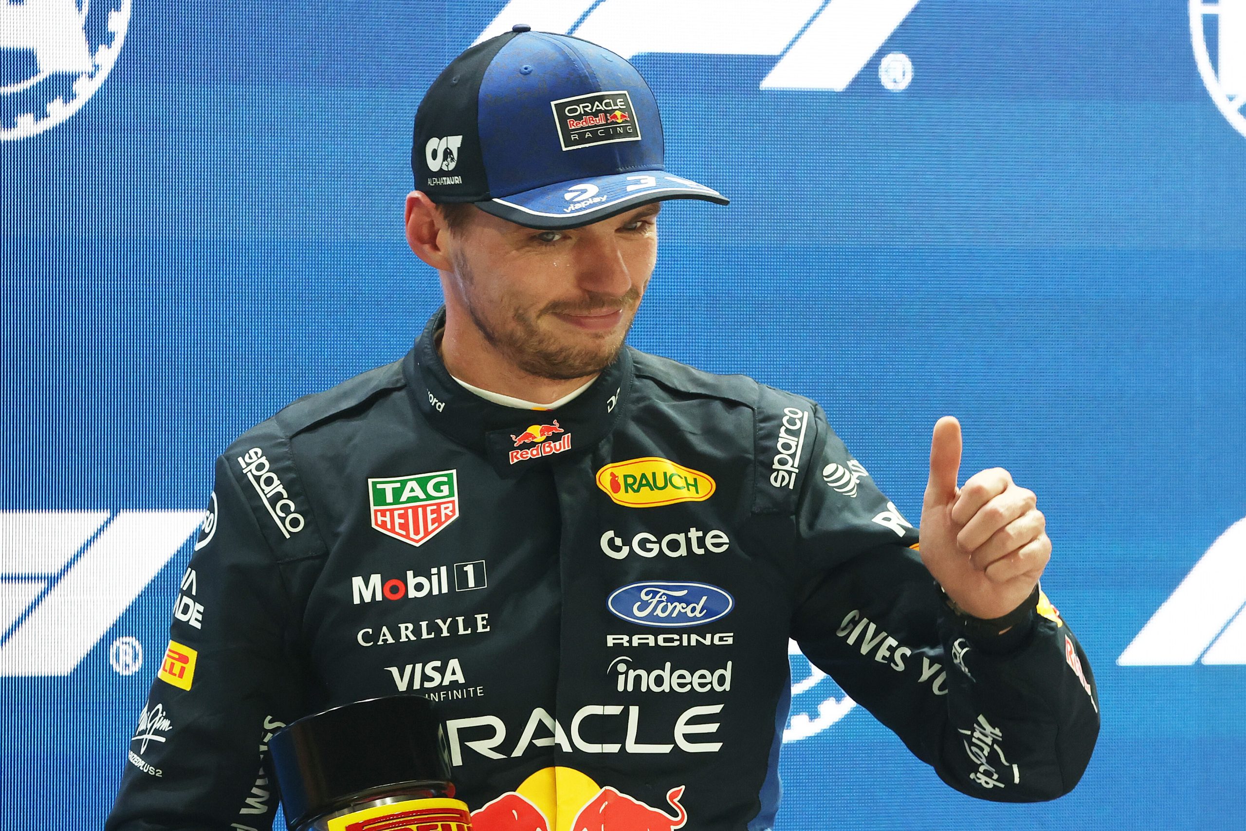 SINGAPORE, SINGAPORE - OCTOBER 09: Sprint Pole qualifier Max Verstappen of the Netherlands and Oracle Red Bull Racing gives a thumbs up in parc ferme during Sprint Qualifying ahead of the F1 Grand Prix of Singapore at Marina Bay Street Circuit on October 09, 2026 in Singapore, Singapore. (Photo by Sam Bloxham/LAT Images) // Getty Images / Red Bull Content Pool // SI202610090723 // Usage for editorial use only //
