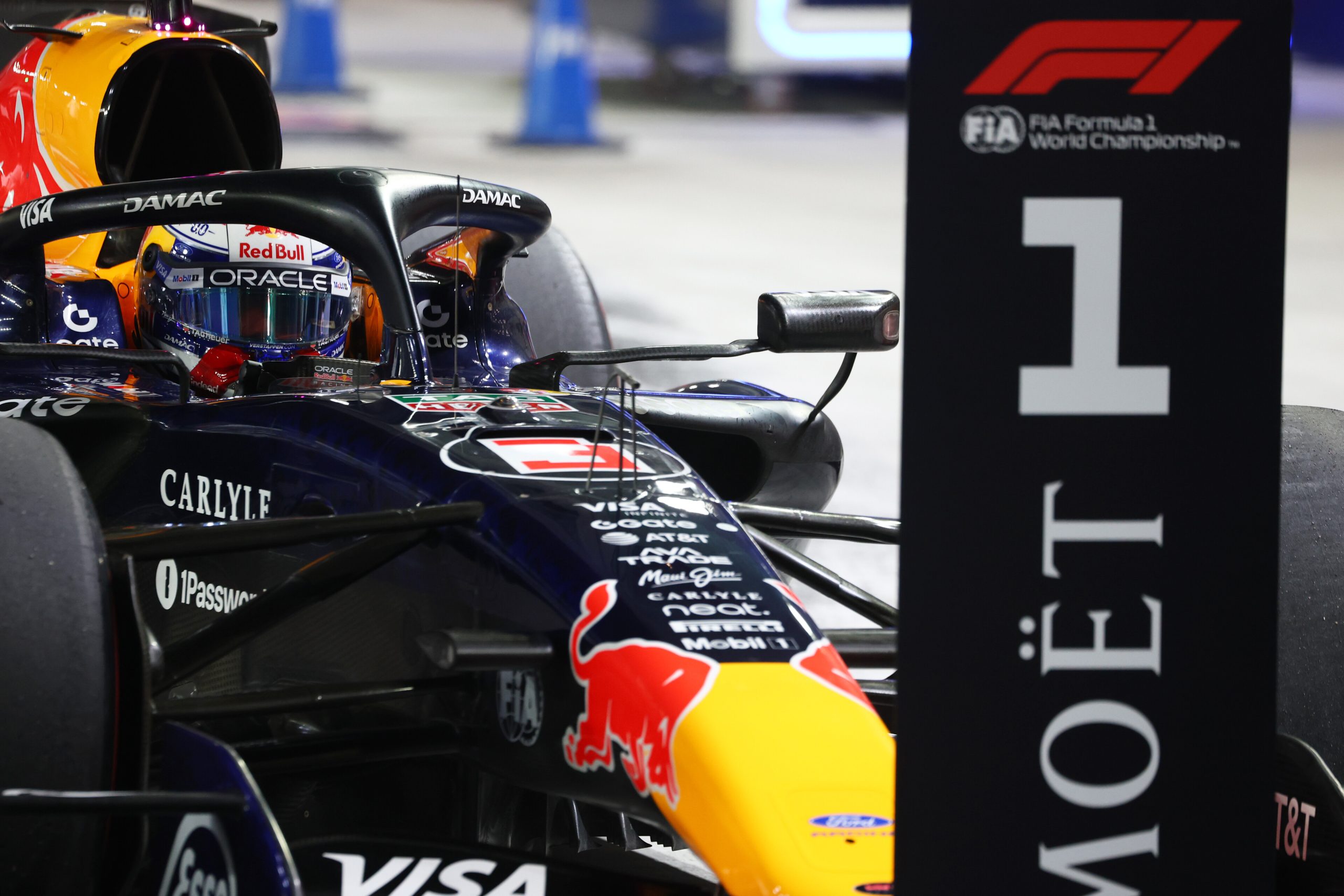 SINGAPORE, SINGAPORE - OCTOBER 10: Pole position qualifier Max Verstappen of the Netherlands and Oracle Red Bull Racing arrives in parc ferme during qualifying ahead of the F1 Grand Prix of Singapore at Marina Bay Street Circuit on October 10, 2026 in Singapore, Singapore. (Photo by Sam Bloxham/LAT Images)